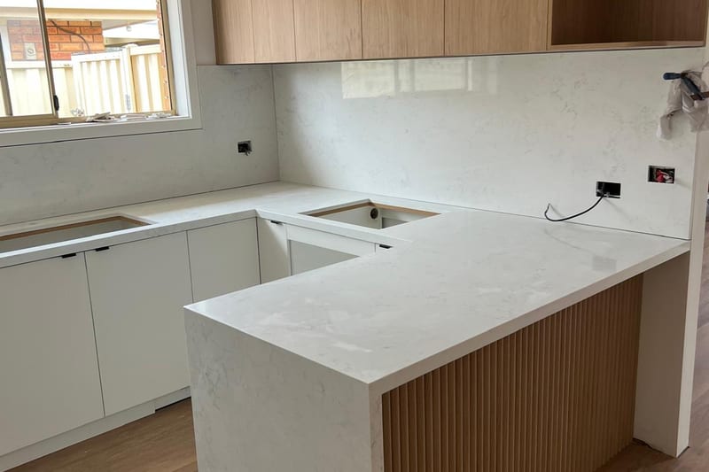 Full-height splashback, fluted island end