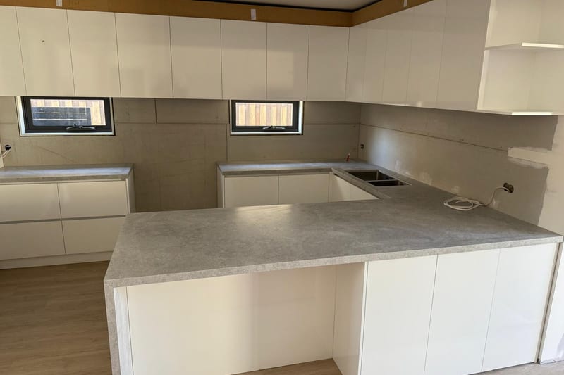 Travertine-look benchtop, U-shaped kitchen